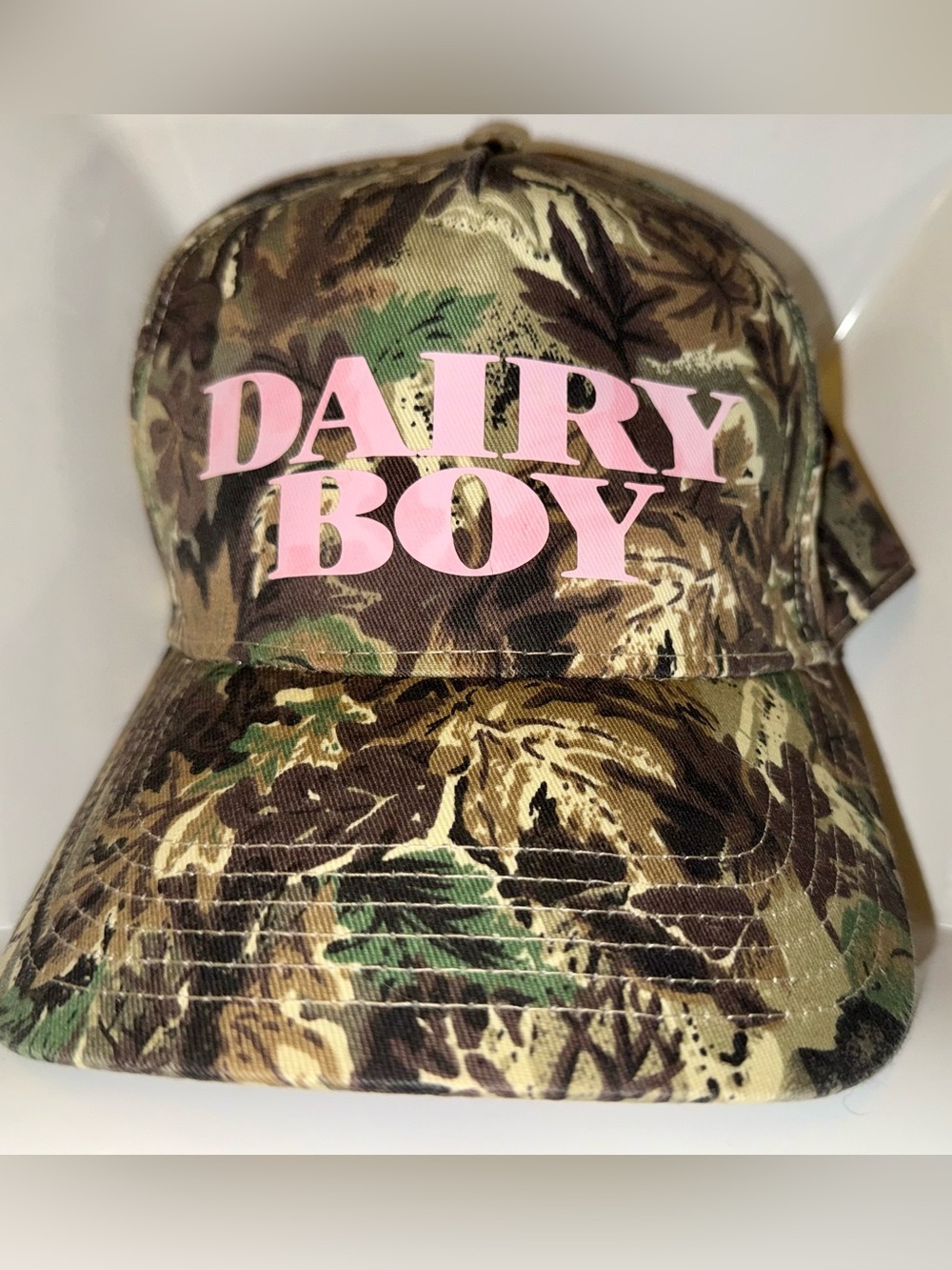 Dairy Boy River Camo Trucker Hat with Pink Logo